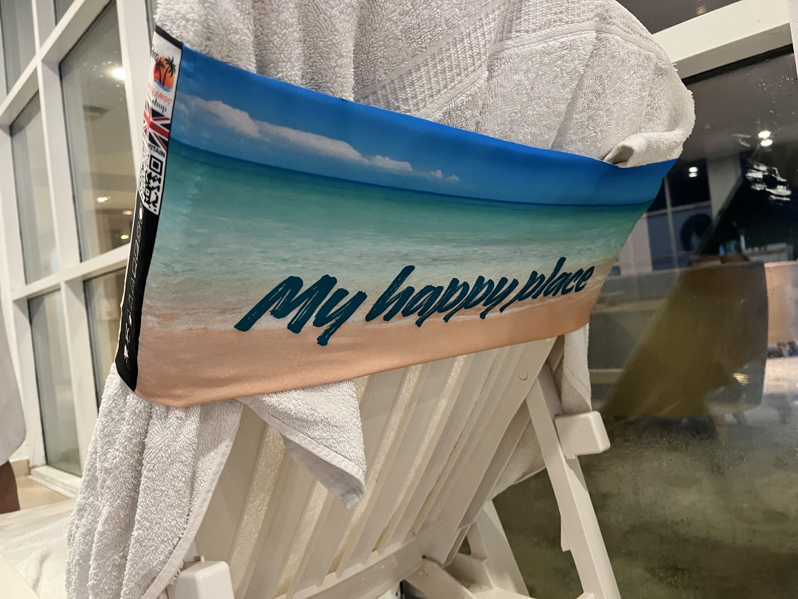 This is the picture of the back of a sunlounger showing the band wrapping around it and the towel
