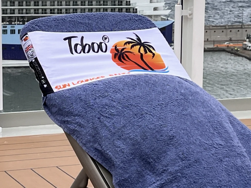 tcboo sun lounger towel band securing a blue towel aboard P&O Arvia in the North Atlantic