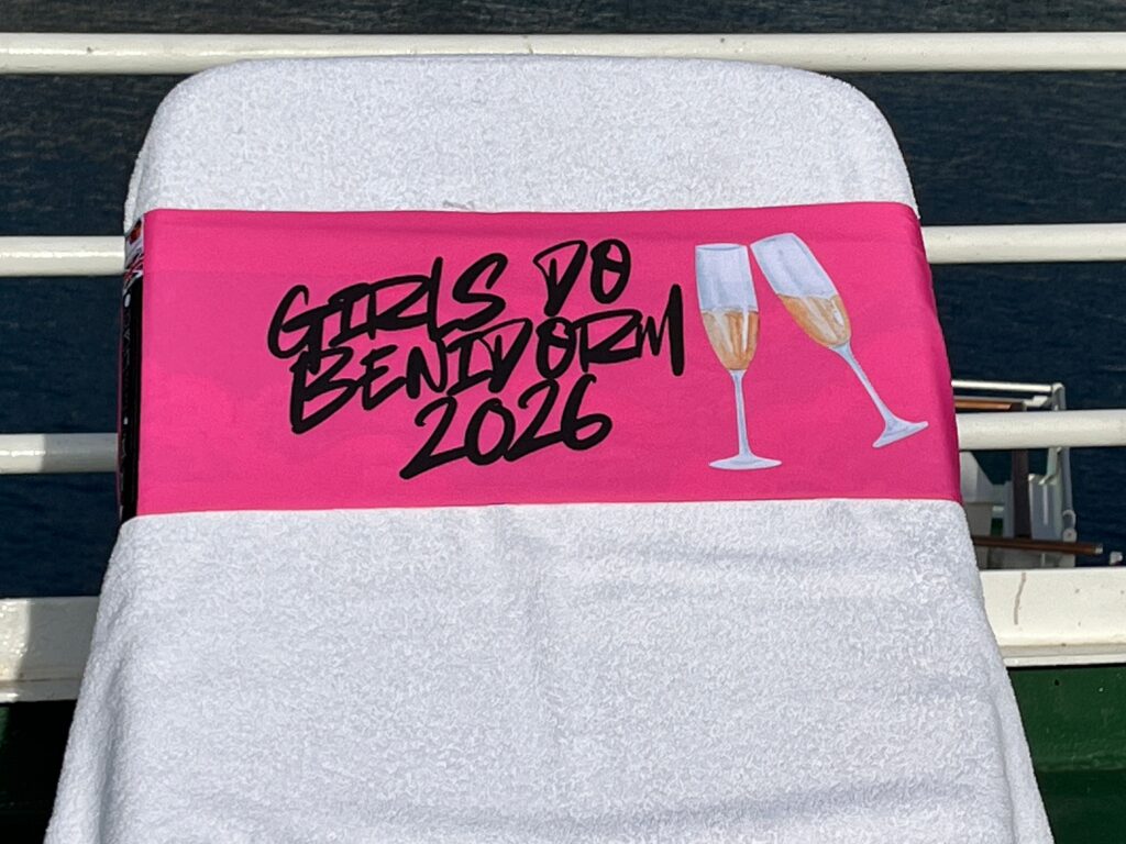 Girls Do Benidorm 2026 pink tcboo sun lounger band with Prosecco-glass design