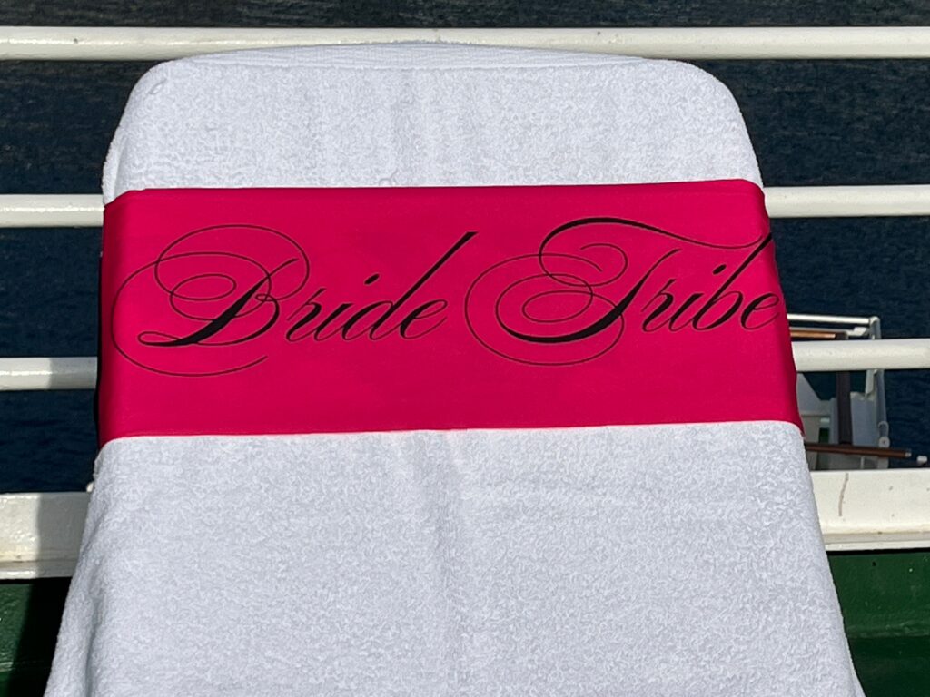 Bride Tribe cerise tcboo sun lounger band securing a towel to a sun lounger