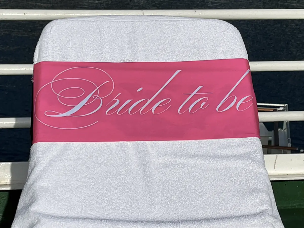 Pink Bride to Be tcboo sun lounger towel band securing a beach towel