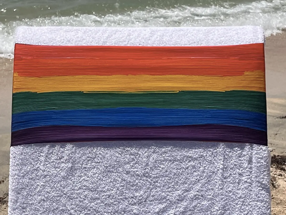 Rainbow pride tcboo sun lounger towel band securing a beach towel