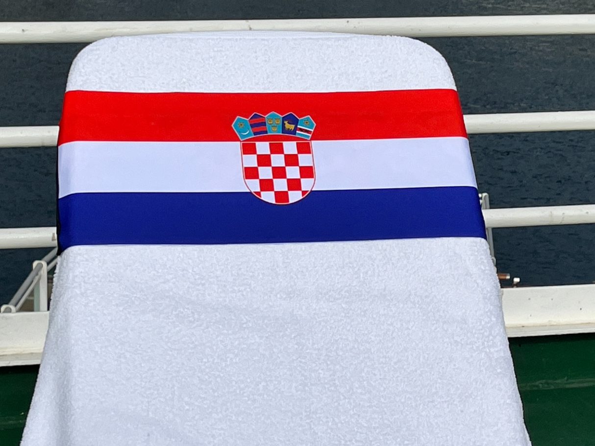 The Croatian National Flag A Croatian National flag holding a towel onto a sun lounger. see tcboo.shop