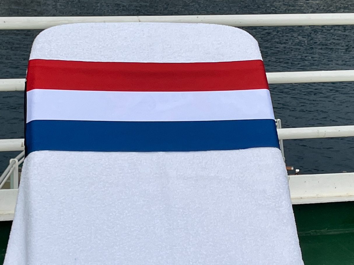 The Netherlands National flag The National flag of the Netherlands holding a towel onto a sun Lounger. See tcboo.shop