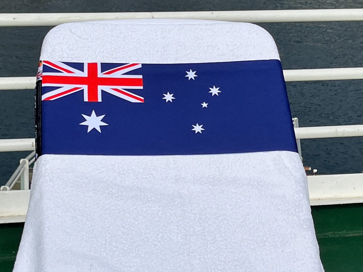 The Australian National flag An Australian National flag holding a towel onto a sun lounger. see tcboo.shop