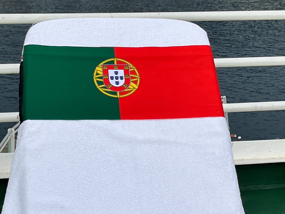 Portuguese National flag The National flag of Portugal holding a towel onto a sun lounger. see tcboo.shop
